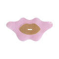 Roze mondtape patch met beige verzorgende laag en kleine opening in het midden
