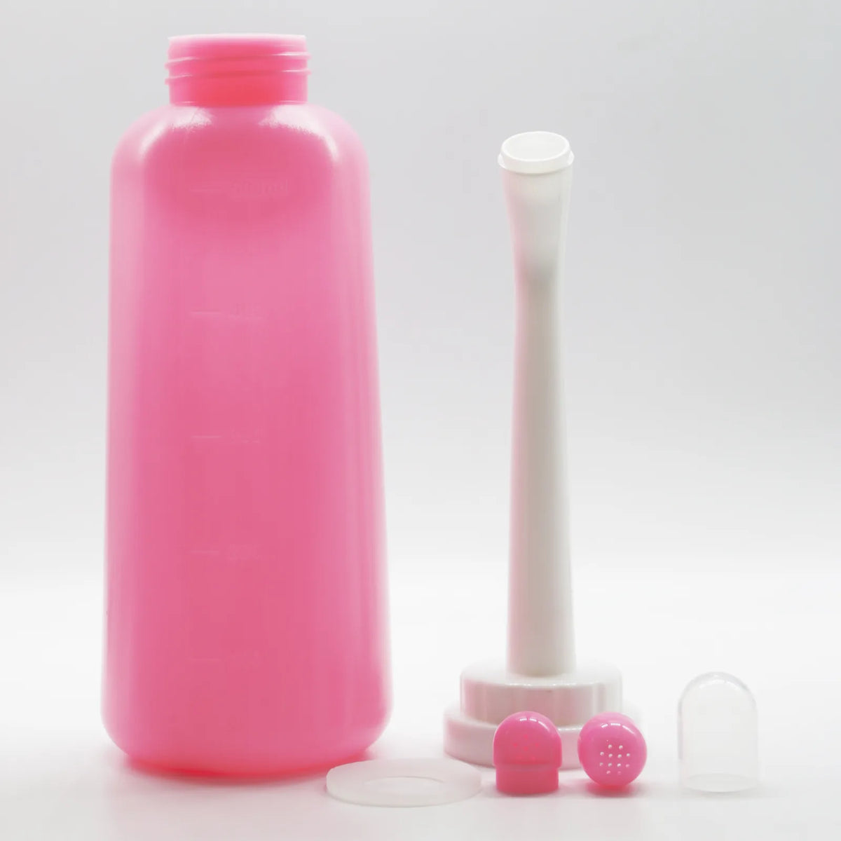 Alle onderdelen: fles, sproeikop, afdichtring, twee zachte opzetstukken en stofkapje